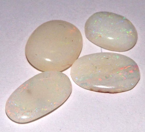 אופל אש Opal מלוטש לשיבוץ אוסטרליה 4 יחידות משקל: 3.50 קרט מידה: 7*10 \ 8*6 מ"מ